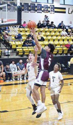 Littlefield senior, Jeremiah Trevino, gets into the paint for a lay-up, during the second half of the Wildcats’, 89-16, victory over Post on the road on Monday. (Staff Photo by Derek Lopez)