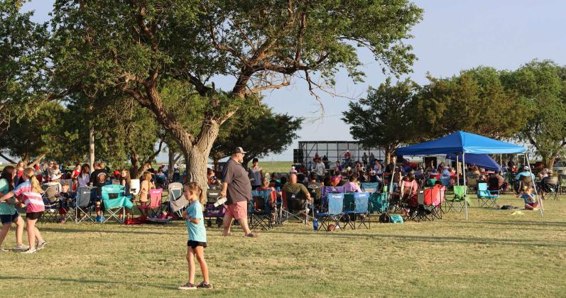 People kick back and enjoy the sunshine and music, during the Springlake 4th of July Celebration last Thursday. (Photo by Ann Reagan)