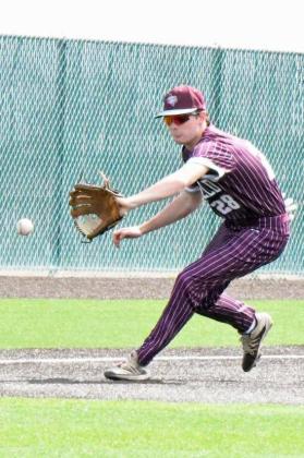 Littlefield third baseman, Chip Green, fields a chopper and throws it to first for the first out in the top of the fourth inning of their finalgame of tournament play on Saturday against Perryton. (Staff Photo by Derek Lopez)