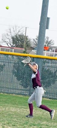 Littlefield senior right fielder, Myli Hernandez, gets under a fly ball for an out in right field, during the Lady Cats’, 14-6, victory over the Lady Eagles on Monday. (Staff Photo by Derek Lopez)
