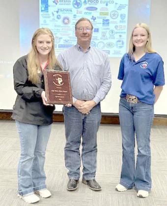 4-H Water Ambassadors Brindle Harper, left, and Tatum Westbrook (right) presented HPWD Board President Lynn Tate with a plaque of appreciation at the November regular board meeting. They expressed their appreciation for HPWD’s support and investment in their learning experience. (Submitted Photo)