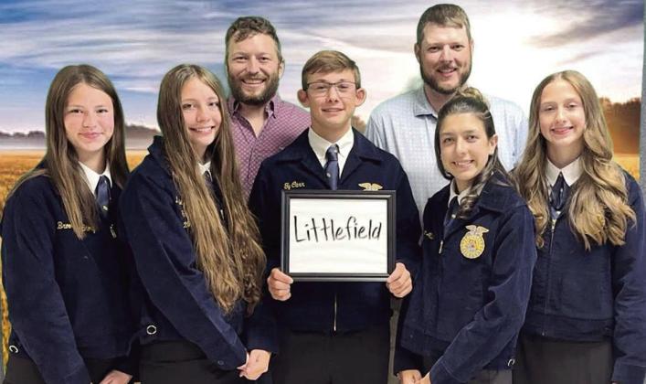 Former agriculture teacher Sheridan Franks (Back Right) stands behind FFA students, Brooklynne Story, Maggie McNeese, Ty Carr, Tayte Miller and Piper Carr, as Ty Carr holds a “Littlefield” sign at Littlefield High School. (Submitted Photo)