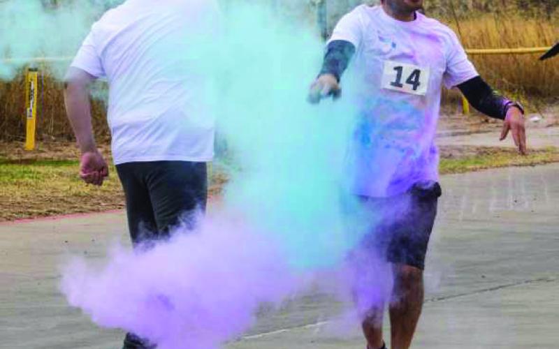 Runners get blasted with color during the 2026 LHC 5K Color Run on Saturday. (Photo by Madison Vidales)