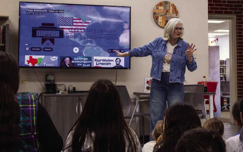 Olton Area Librarian Jocelyn Mandrell, presents a Texas history video to Olton fourth-grade students.