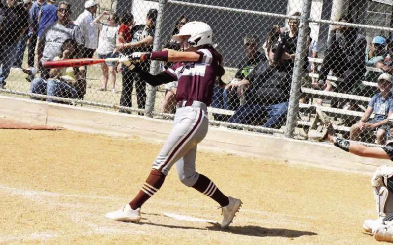 Littlefield senior, Bryndle Ray, blasts a two-run homerun in the top of the seventh inning on Saturday to help lift the Lady Cats past Muleshoe, 19-18, in their first meeting of district play. (Staff Photo by Derek Lopez)