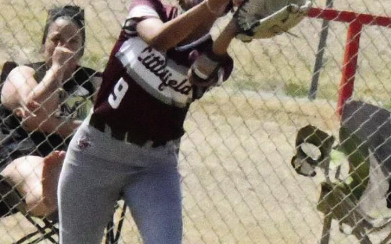 Littlefield freshman, London Taylor, catches a fly ball in right field for the second out in the bottom of the seventh inning of the Lady Cats, 19-18, victory over Muleshoe on Saturday. (Staff Photo by Derek Lopez)