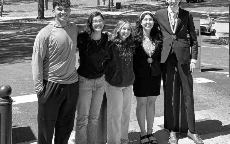 Andrew Godwin, Angelina Godwin, Alyssa Montes, Bethani Magby and Caden Edens pose in front of the state capitol during their trip to Austin for the CX Debate State Tournament at the University of Texas. (Submitted Photo)