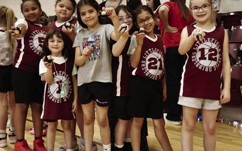 The Littlefield Lady Cats 1st and 2nd Grade Girl’s team coached by Sarah Jaramillo and JG Garza won the Championship game on Sunday to cap off their season. (Shown): Coach Sarah Jaramillo, Ka’Mia Hodge, Hazel Jaramillo, Melanie Parker, Giselley Garza, Lucy Jaramillo, Madison Spain, Jessa McKinnon and Carlie Salinas and Coach JG Garza. (Submitted Photo)